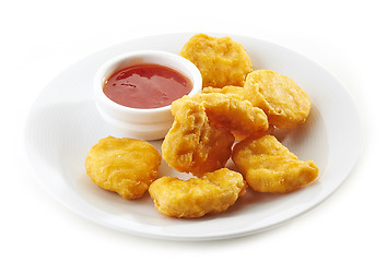 Image showing chicken nuggets and sauce