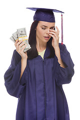 Image showing Stressed Female Graduate Holding Stacks of Hundred Dollar Bills