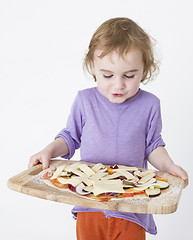 Image showing bringing pizza to the oven