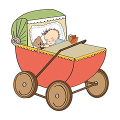 Image showing baby boy in retro stroller isolated on white background