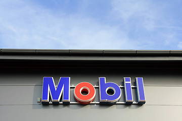 Image showing Sign Mobil on a Shop Wall with Blue Sky