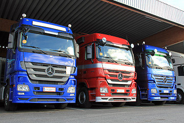 Image showing Row of Mercedes-Benz Actros Trucks in Carport