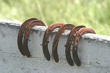 Image showing six horseshoes