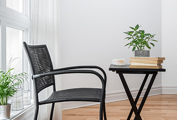 Image showing Chair and table with books to read