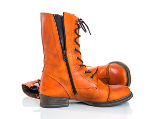 Image showing Orange leather boots on white background