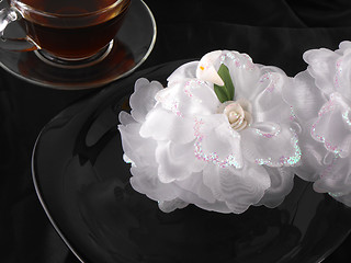 Image showing hot cup of tea or coffee with holiday gift bow ribbon