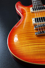 Image showing Cherry sunburst electric guitar