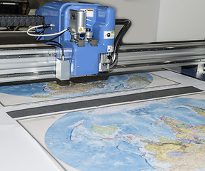 Image showing Plotter plotting some map