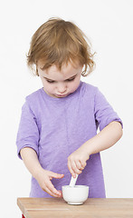 Image showing child working with mortar