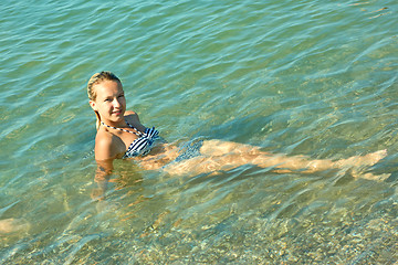 Image showing Teen girl on the coastal seawater