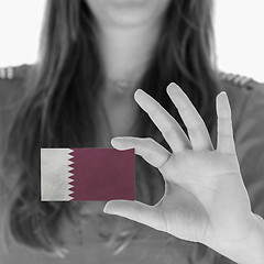 Image showing Woman showing a business card