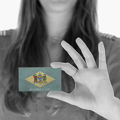 Image showing Woman showing a business card