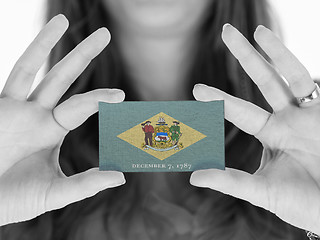 Image showing Woman showing a business card