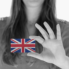 Image showing Woman showing a business card