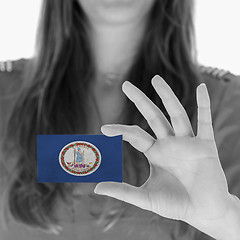 Image showing Woman showing a business card