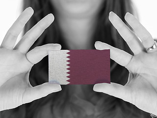 Image showing Woman showing a business card