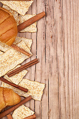 Image showing crackers, cinnamon sticks and fresh croissants