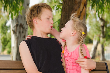 Image showing Two friends boy and girl hugging in park