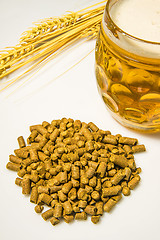 Image showing Hops pellets with beer glass