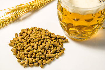 Image showing Hops pellets with beer glass