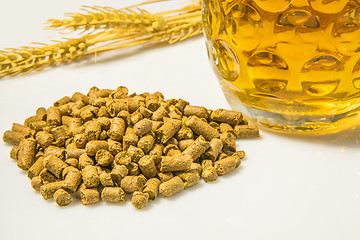 Image showing Hops pellets with beer glass