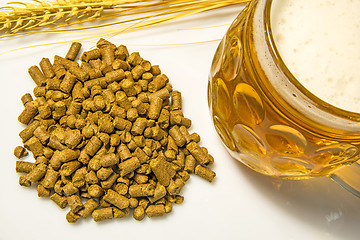 Image showing Hops pellets with beer glass