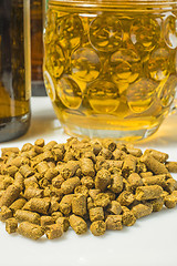 Image showing Hops pellets with beer glass