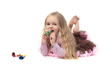 Image showing Little girl in studio lying