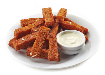 Image showing fried bread sticks with garlic and sauce