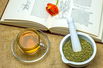 Image showing Rockrose tea with medieval textbook