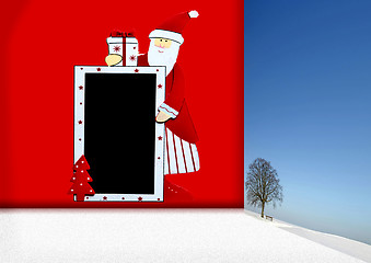 Image showing Santa Claus with blackboard and winter landscape