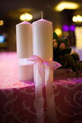 Image showing candles tied with a pink ribbon