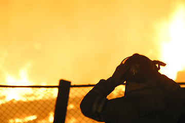 Image showing firefighter in silhouette