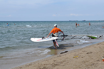 Image showing The man is engaged in windsurfing in the sea