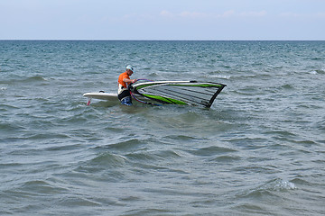Image showing The man is engaged in windsurfing in the sea