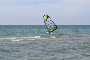 Image showing The man is engaged in windsurfing in the sea