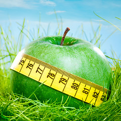 Image showing apple and measuring tape