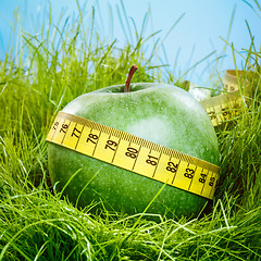 Image showing apple and measuring tape