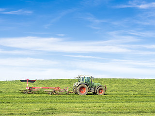 Image showing Tractor on green meadow