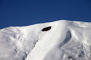 Image showing Trace of avalanche on off-piste slope in sunny day