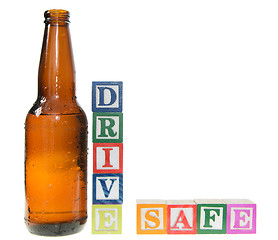 Image showing Letter blocks spelling drive safe with a beer bottle