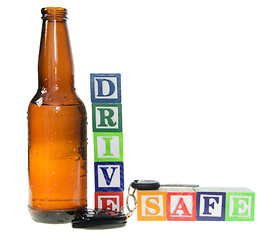 Image showing Letter blocks spelling drive safe with a beer bottle and keys