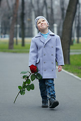 Image showing Little boy walking the park