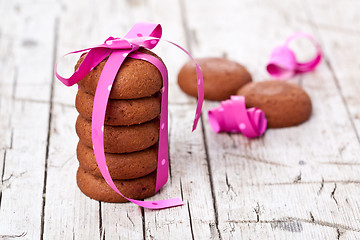 Image showing stack of chocolate cookies tied with pink ribbon