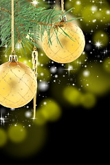 Image showing Pine branch with golden Christmas balls.