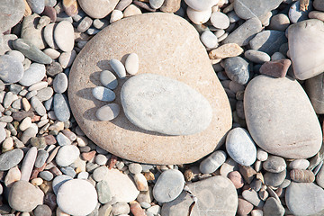 Image showing sea ??stones laid out in the form of foot prints