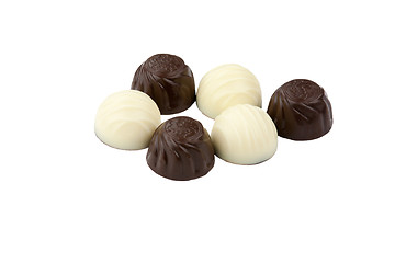 Image showing black and white chocolate on white background