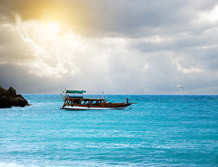 Image showing boat in the sea and stormy sky