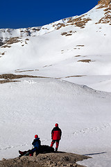 Image showing Two hikers on halt in snow mountains