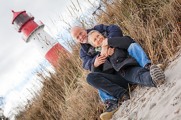 Image showing happy mature couple relaxing baltic sea dunes 